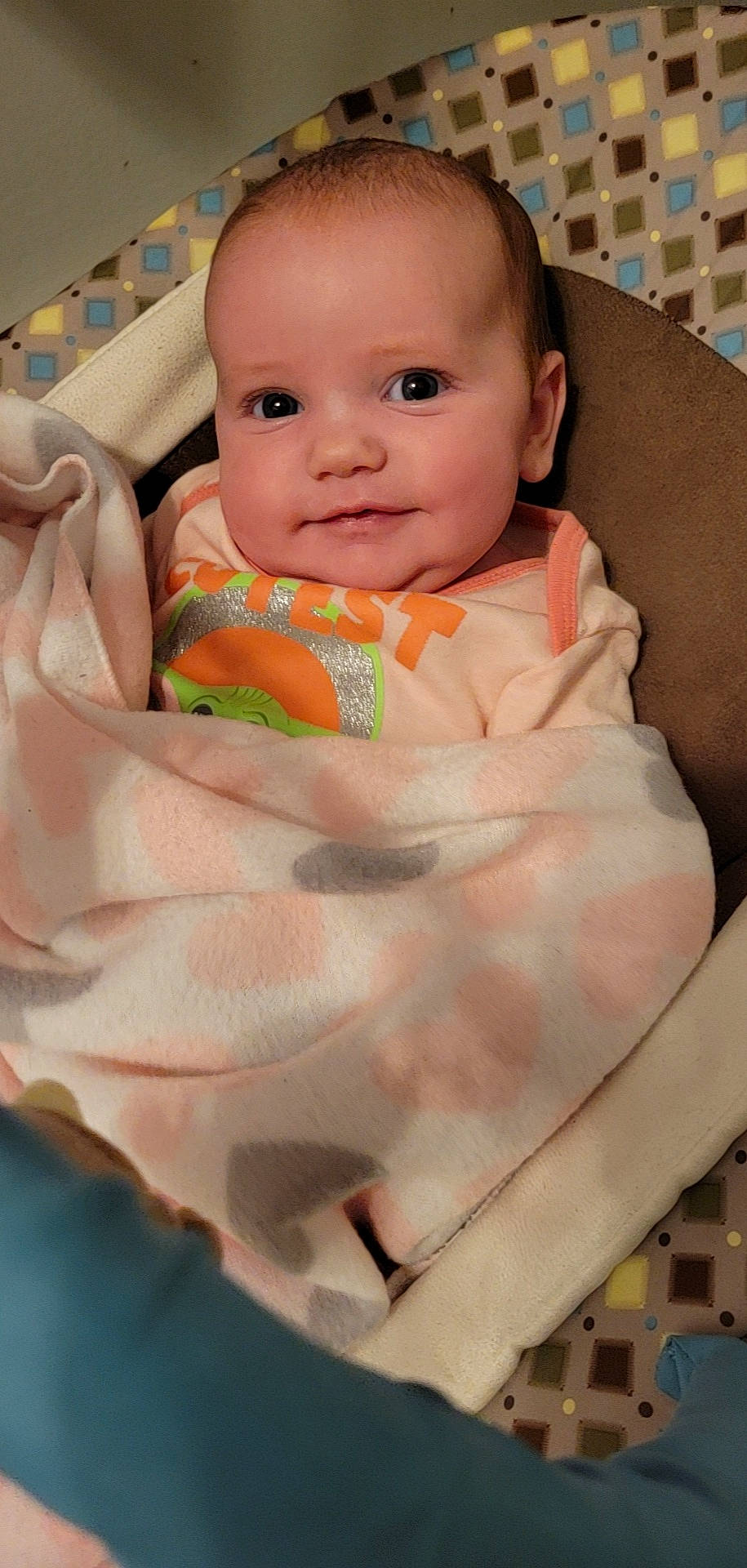 Phoenix is registered to the contest to win money with this photo: abdomen, baby, baby_safety, baby_toddler_clothing, bib, cheek, child, comfort, eye, face, head, human_body, iris, mouth, person, pink, skin, sleeve, smile, stomach