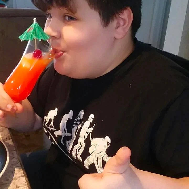 Draven joined the competition — help win amazing prizes! cocktail, comfort_food, drink, drinking, drinkware, finger, food, food_craving, gesture, hand, happy, juice, junk_food, nail, orange_drink, orange_soft_drink, person, soft_drink, t_shirt, tableware