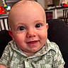 baby, child, smiling, face, eyes, shirt, green, plaid, indoor, home, person, portrait, cute, happy, infant, young, head, skin, button, background