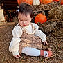 Reyna joined the competition — help win amazing prizes! child, toddler, pumpkin, hay, autumn, outdoor, cute, dress, socks, leaf_litter, fall, nature, person, curly_hair, ground, seasonal, brown, orange, white, casual
