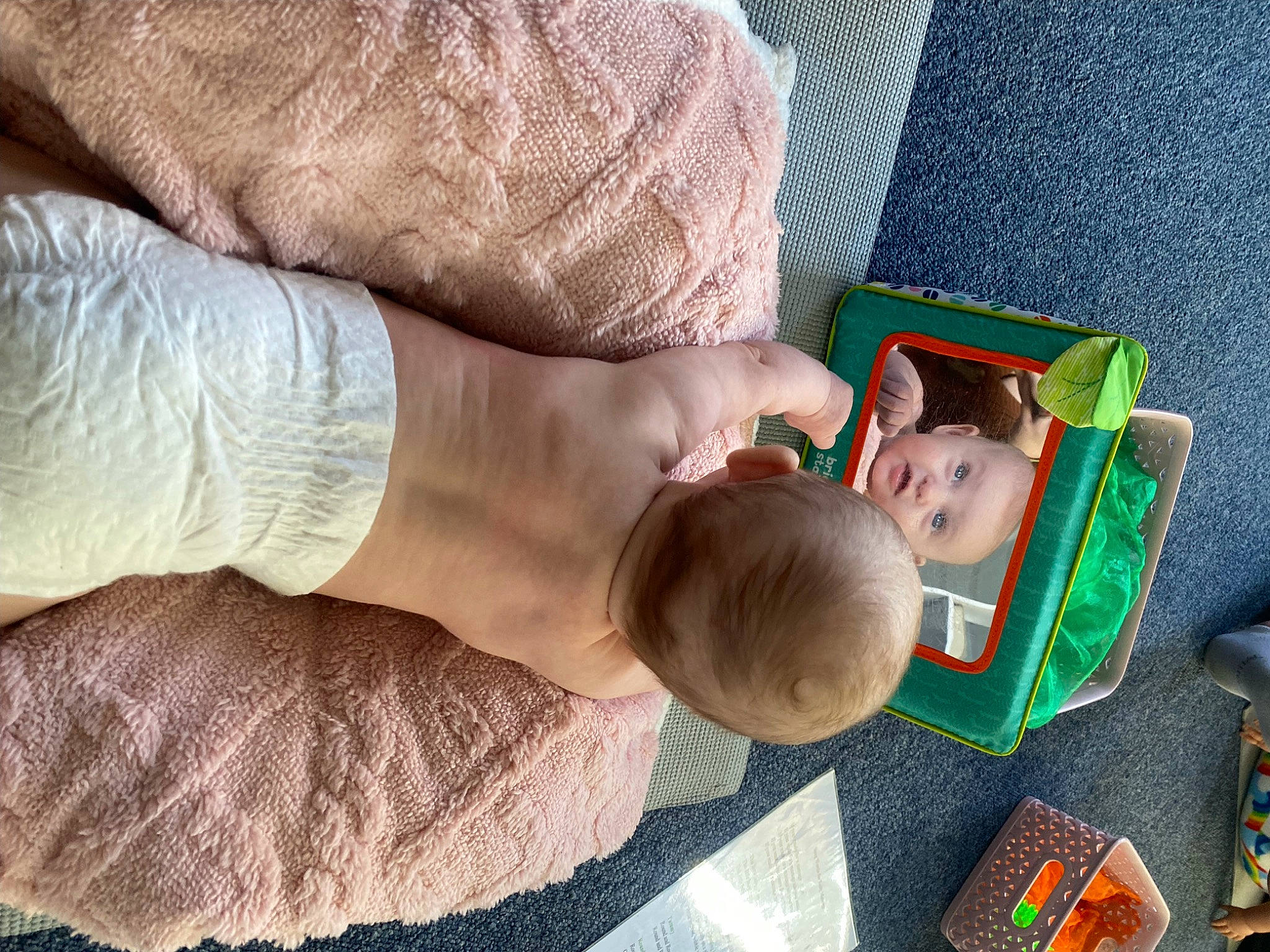 Nova is registered to the contest to win money with this photo: baby, baby_products, child, comfort, finger, flooring, foot, gesture, hand, human_leg, linens, nail, person, room, sitting, skin, thigh, thumb, toddler, wood