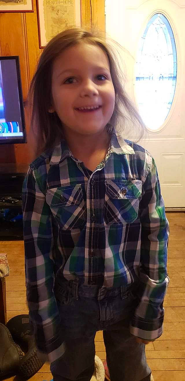 Michael joined the competition — help win amazing prizes! design, face, head, joy, long_hair, outerwear, pattern, person, plaid, shirt, sleeve, smile, tartan, textile