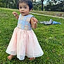 toddler, child, barefoot, dress, grass, outdoor, park, trees, sky, young_child, curious, person, nature, daylight, small_pony_tail, greenery, casual, cute, portrait, standing