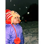 Jaylannie is registered to the contest to win money with this photo: child, child_outdoors, cold_weather, cute, face, frosty, glowing_face, hat, night, outdoor, portrait, puffy_jacket, purple_jacket, snow, snowflakes, warm_clothing, winter_clothing, winter_hat, winter_night, young_child