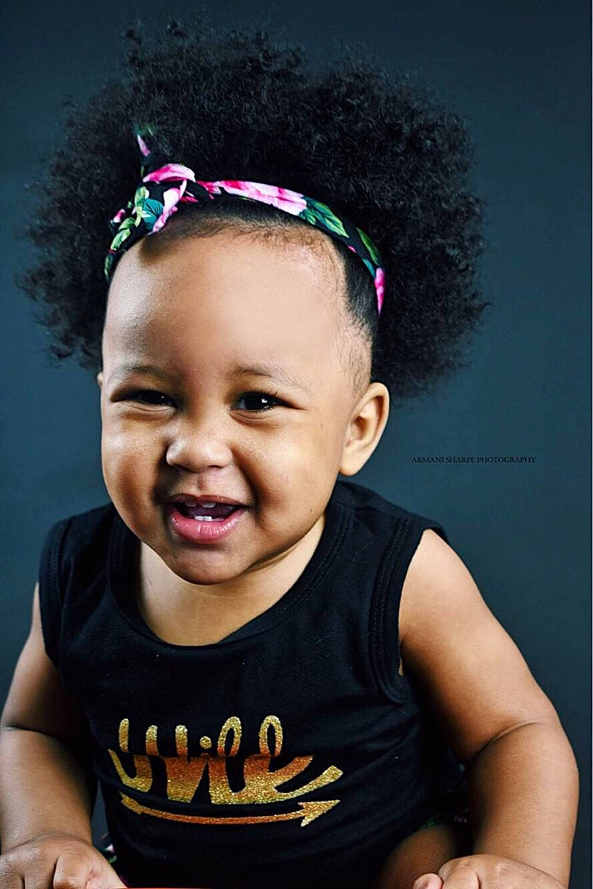 Taegan is registered to the contest to win money with this photo: cheek, child, cool, ear, fashion_accessory, forehead, fun, girl, hair_accessory, happiness, head, headgear, headpiece, joy, person, pink, smile, toddler