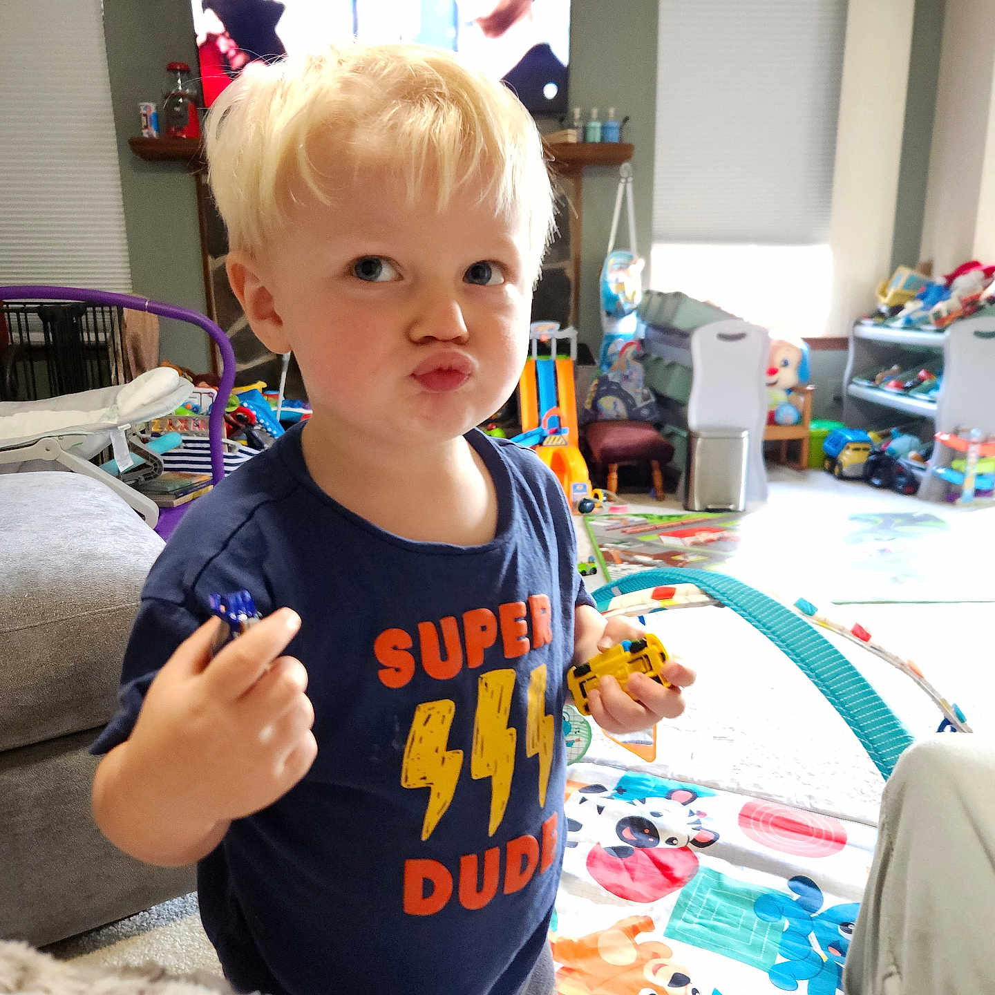 Nicolas is registered to the contest to win money with this photo: adult, architecture, baby, bodypart, building, clothing, couch, face, finger, furniture, hand, head, indoors, livingroom, male, person, photography, portrait, room, t_shirt