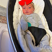 Eleanor is registered to the contest to win money with this photo: baby, infant, newborn, headband, bow, onesie, striped_onesie, bouncer, baby_bouncer, blanket, face, wide_eyes, cozy, indoor, soft_lighting, harness, stroller_mount, cute, sleeping_area, brand_4moms