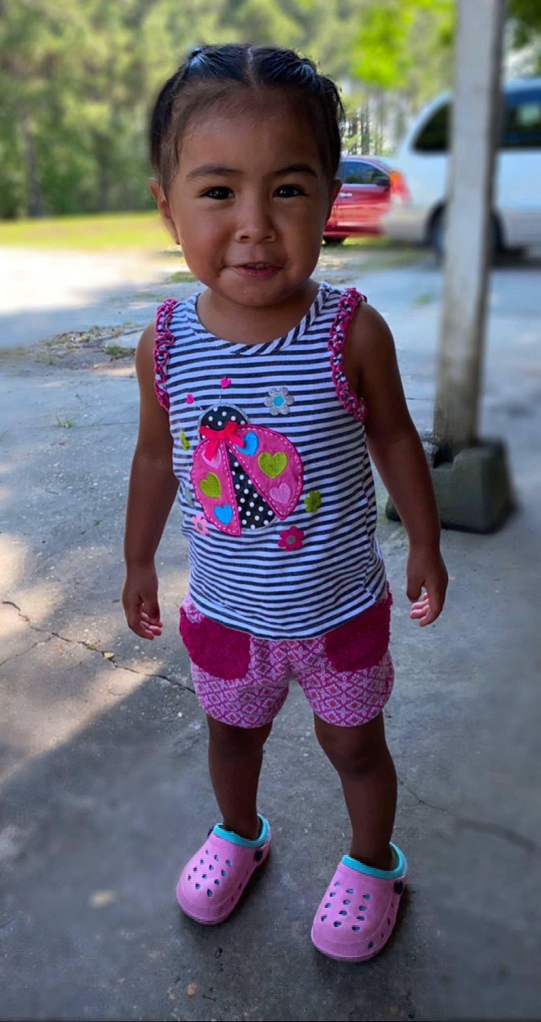 Verenice is registered to the contest to win money with this photo: baby_toddler_clothing, eye, face, grass, hair, happy, head, human_body, joint, person, pink, red, shorts, shoulder, skin, sleeve, smile, summer, t_shirt, toddler