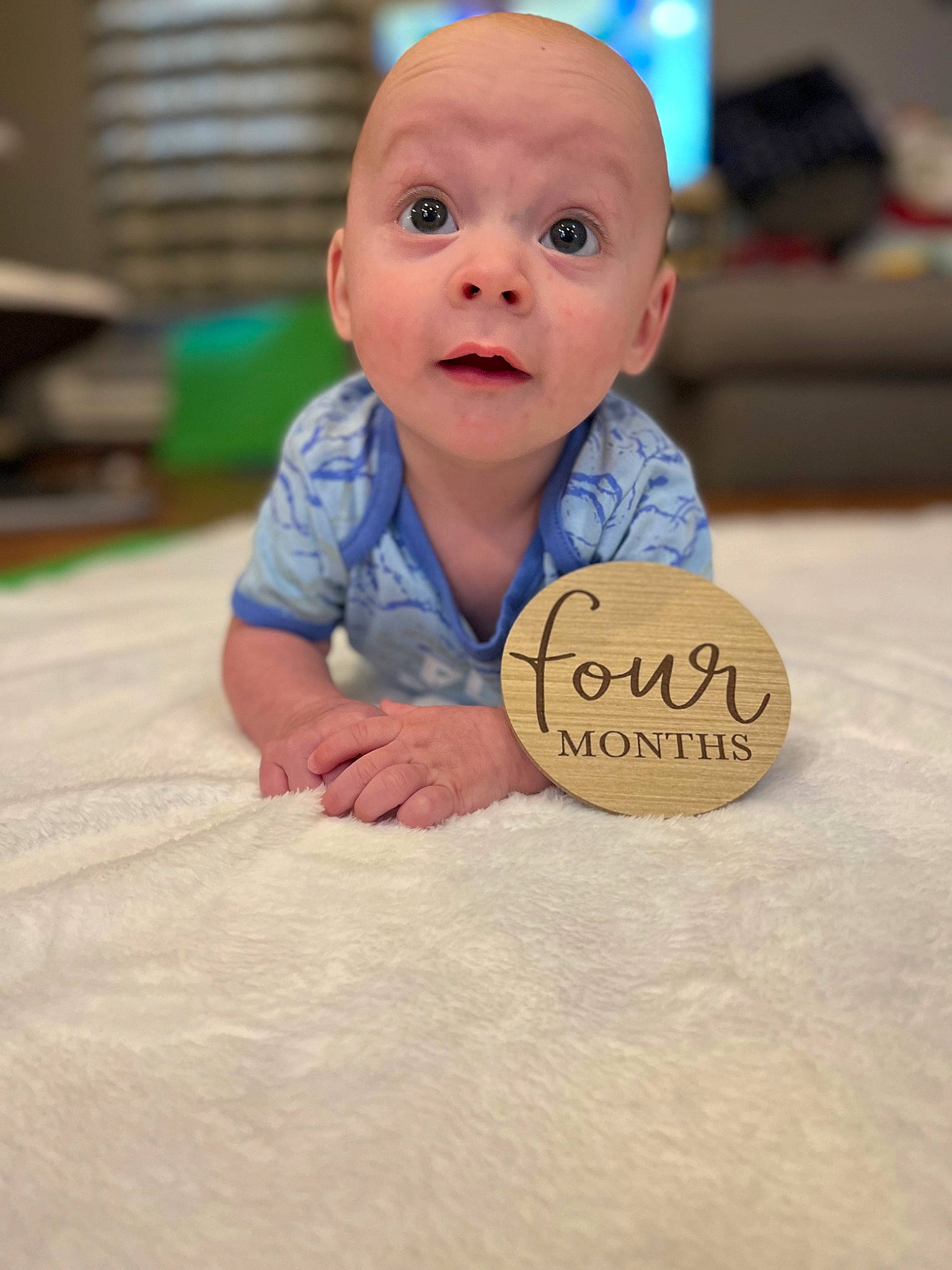 Dawson is registered to the contest to win money with this photo: baby, baby_toddler_clothing, cheek, chin, comfort, crawling, finger, floor, flooring, fun, gesture, happy, hardwood, nose, person, skin, smile, surprise, thumb, toddler