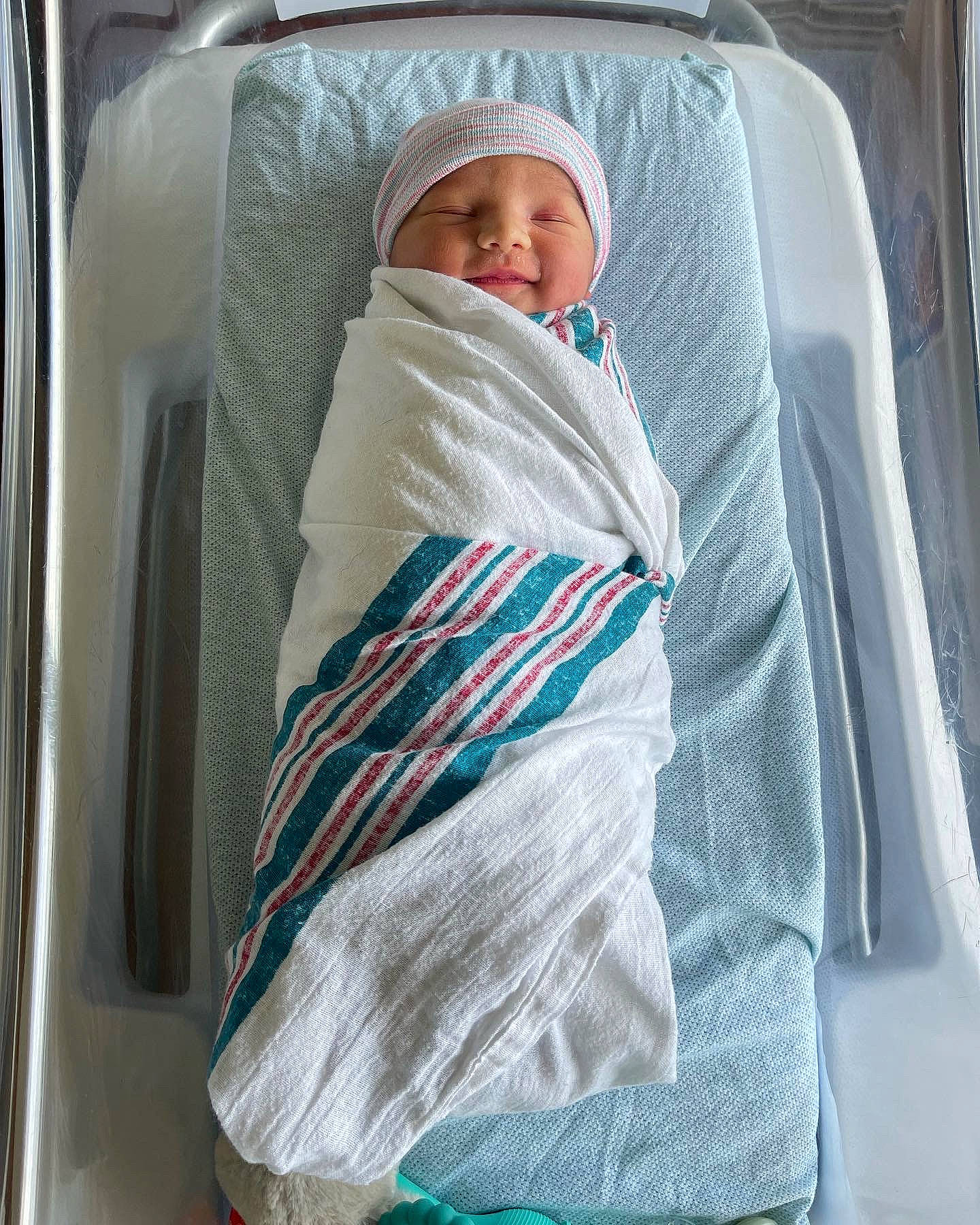 Katerina is registered to the contest to win money with this photo: auto_part, automotive_exterior, baby, baby_products, baby_safety, baby_sleeping, baby_toddler_clothing, car_seat, child, comfort, electric_blue, family_car, headwear, infant_bed, linens, person, product, sitting, sleeve, tints_and_shades