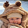 baby, blue_eyes, bundle, child, closeup, cold_weather, cozy, cute, face, fur_texture, hat, hood, infant, jacket, outdoor, reindeer_ears, smile, snow, warm_clothing, winter