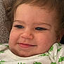 toddler, child, smile, face, closeup, dinosaur_print, shirt, clothing, happy, baby, infant, portrait, cute, cheeks, eyes, skin, hair, fabric, texture, resting
