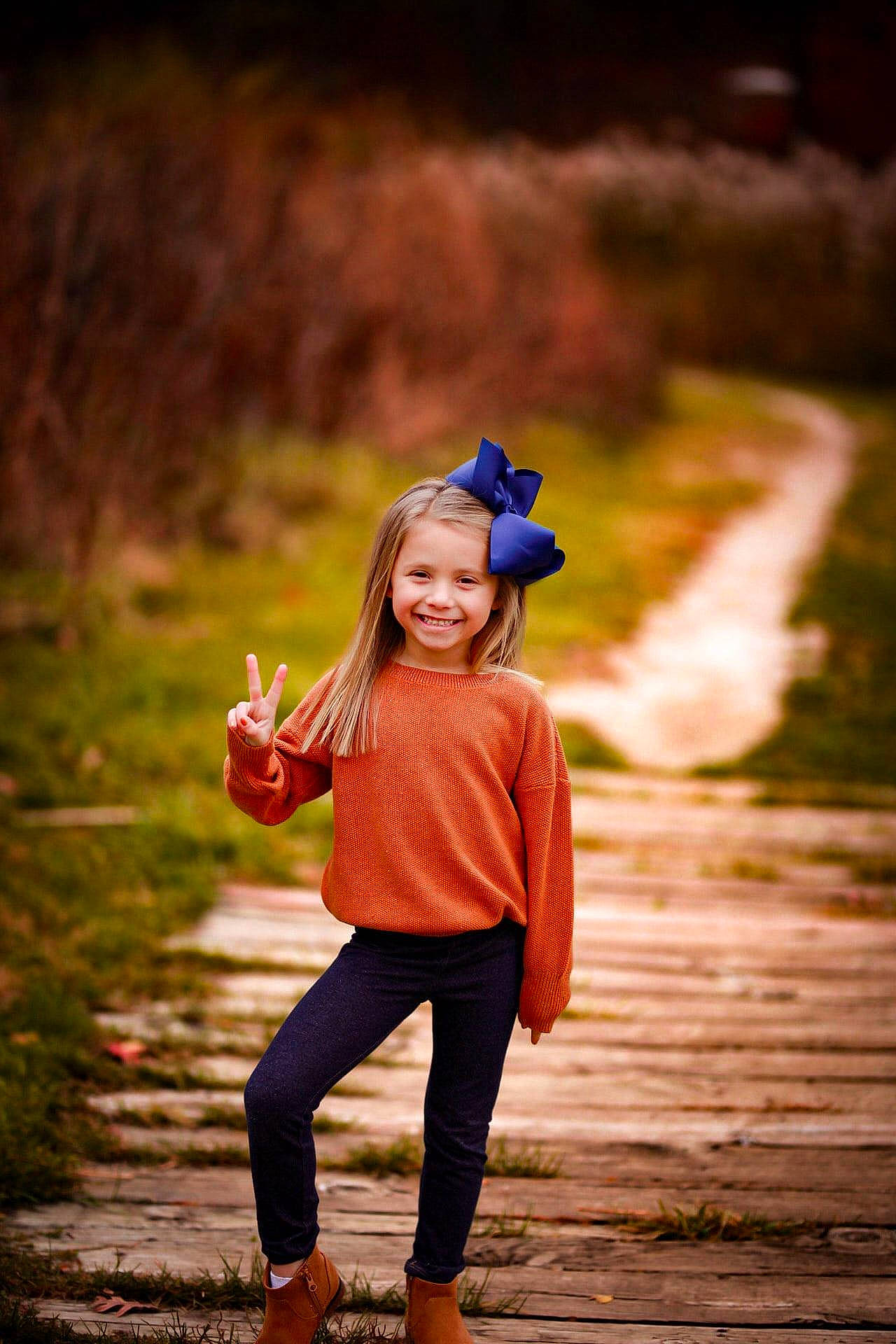 Paislee is registered to the contest to win money with this photo: blond, cap, child, electric_blue, flash_photography, fun, grass, happy, hat, joy, landscape, leaf, leisure, people_in_nature, person, plant, smile, standing, sunlight, toddler