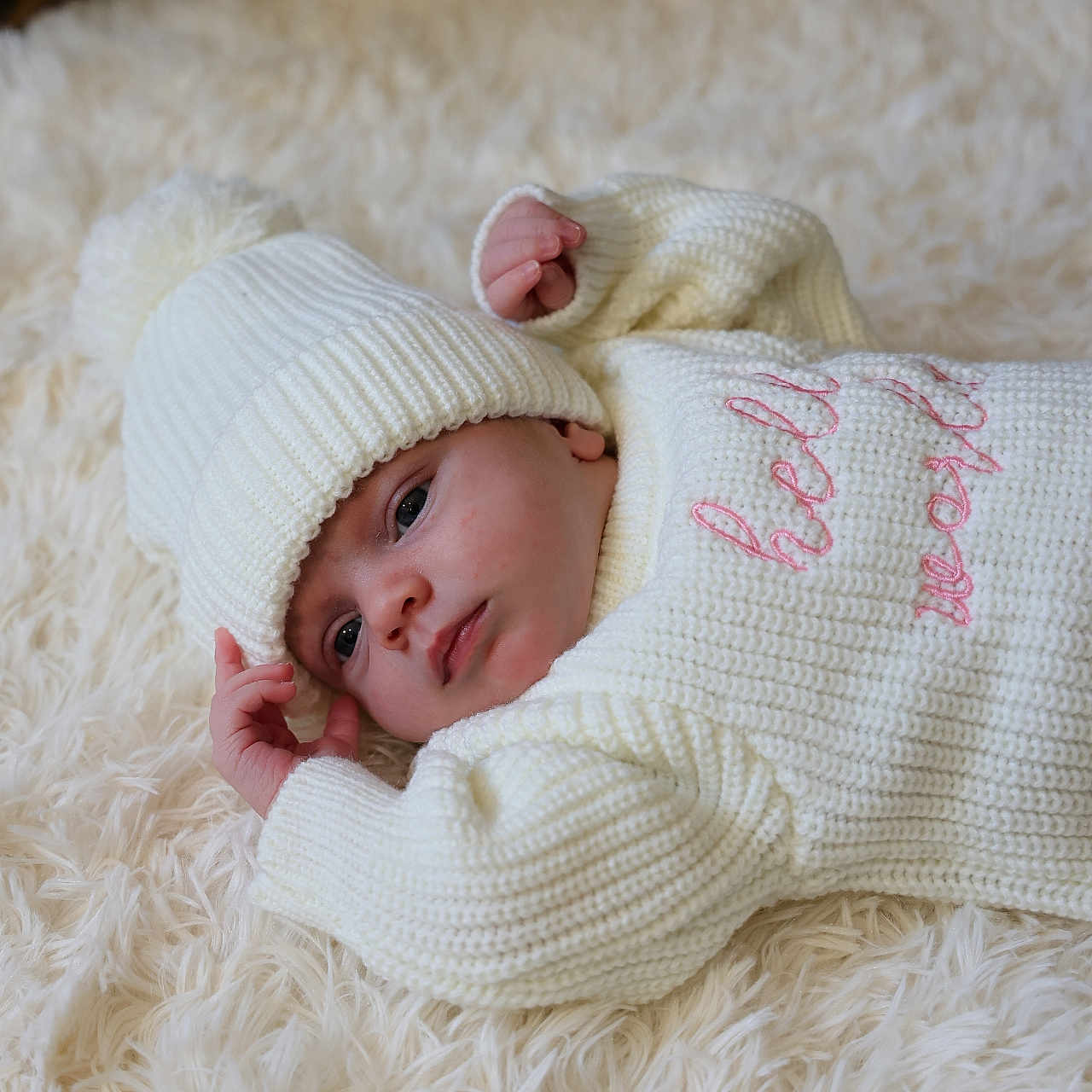 Avaleigh is registered to the contest to win money with this photo: baby, beanie, bodypart, bonnet, cap, clothing, face, finger, hand, happy, hat, head, hoodie, knitwear, newborn, person, photography, portrait, sweater, sweatshirt