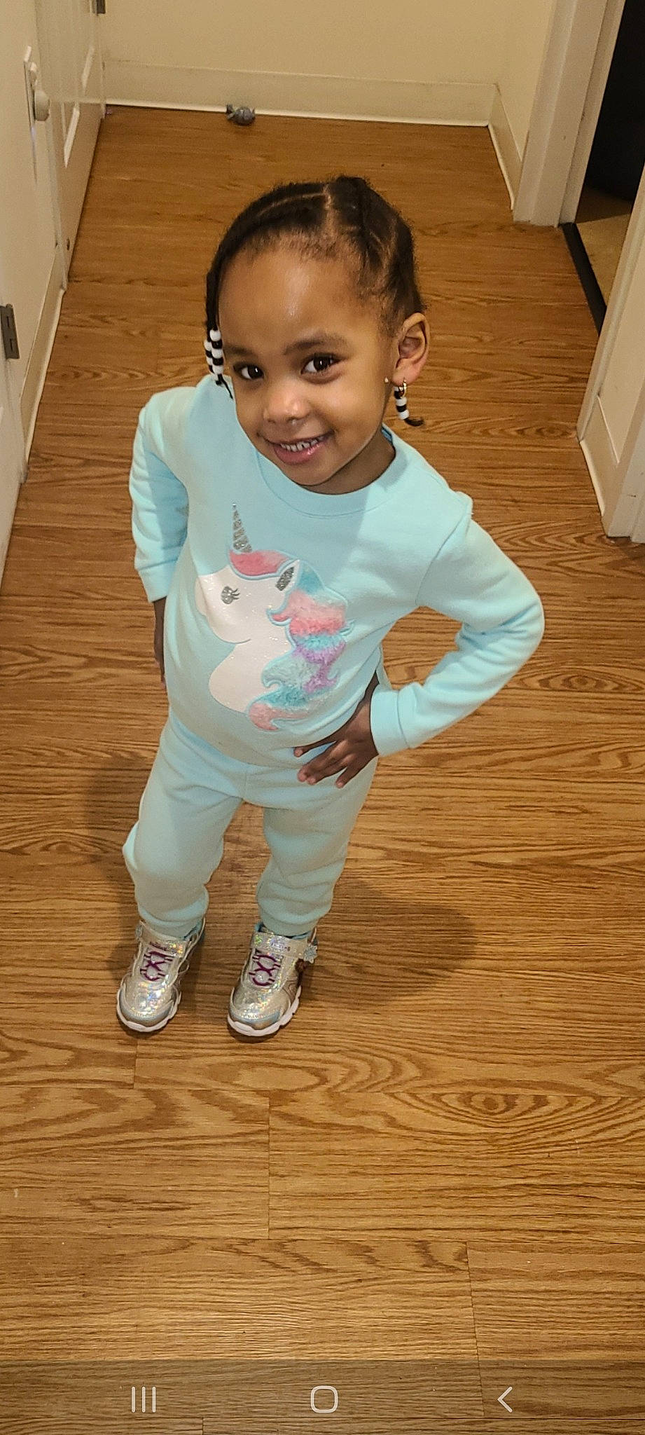 Janae is registered to the contest to win money with this photo: baby, baby_toddler_clothing, cheek, child, face, floor, flooring, head, joy, leg, person, pink, play, skin, sleeve, smile, standing, t_shirt, toddler