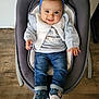 baby, infant, child, smiling, headband, blue_headband, bow, jeans, baby_shoes, rocker, baby_rocker, wooden_floor, clothing, cute, happy, person, indoors, seated, casual_wear, portrait
