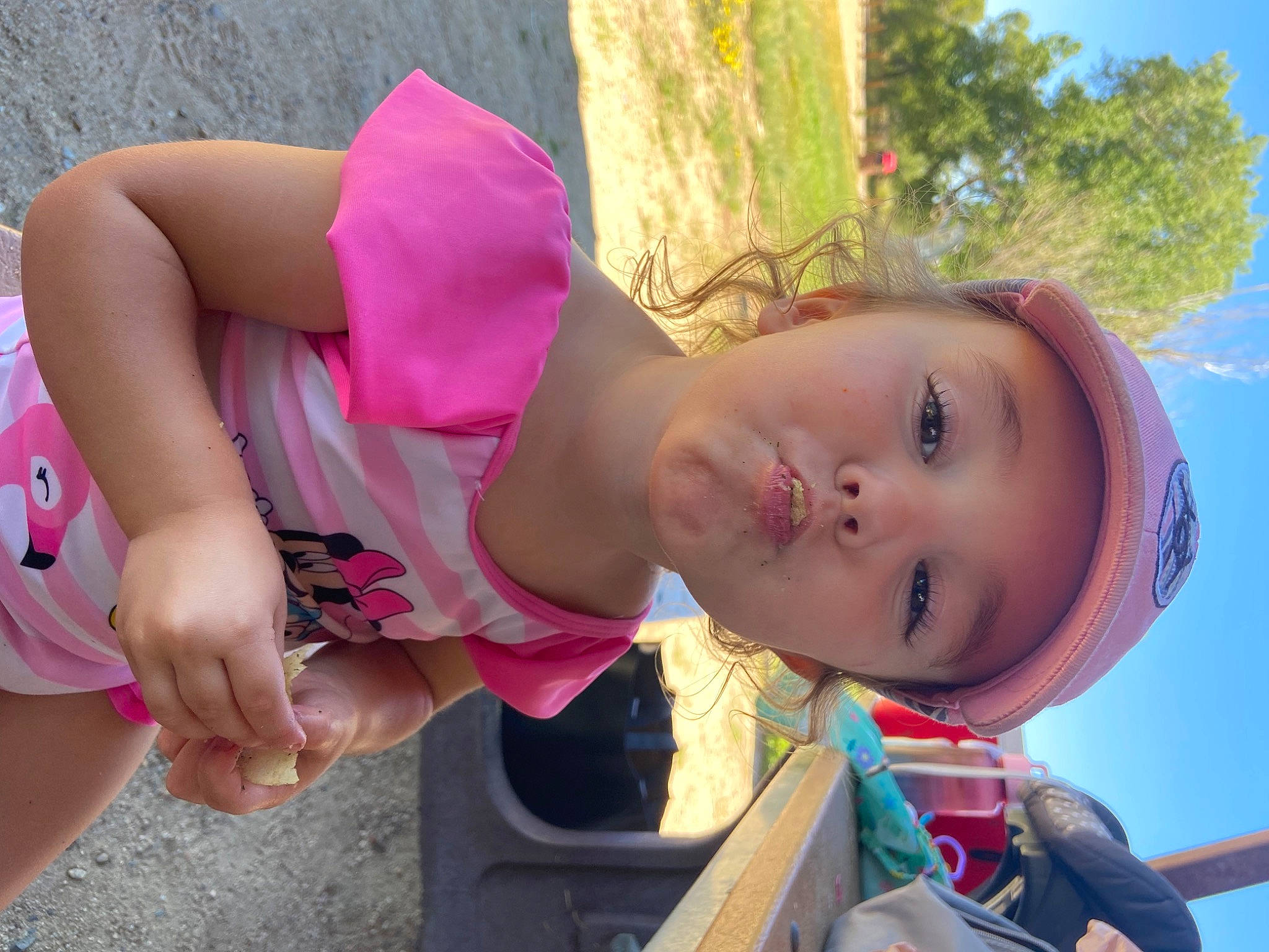 Elizabeth joined the competition — help win amazing prizes! child, city, fun, grass, happy, headwear, human_body, leisure, magenta, person, pink, plant, play, recreation, sitting, skin, sky, smile, sun_hat, toddler
