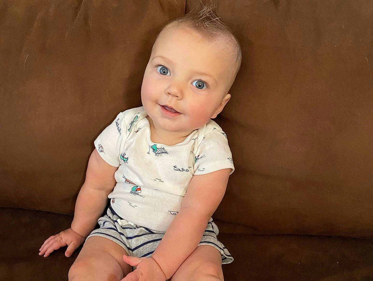 Easton is registered to the contest to win money with this photo: baby, baby_toddler_clothing, cheek, child, collar, flash_photography, flooring, fun, happy, head, human_leg, iris, joy, neck, pattern, person, portrait_photography, sitting, skin, sleeve