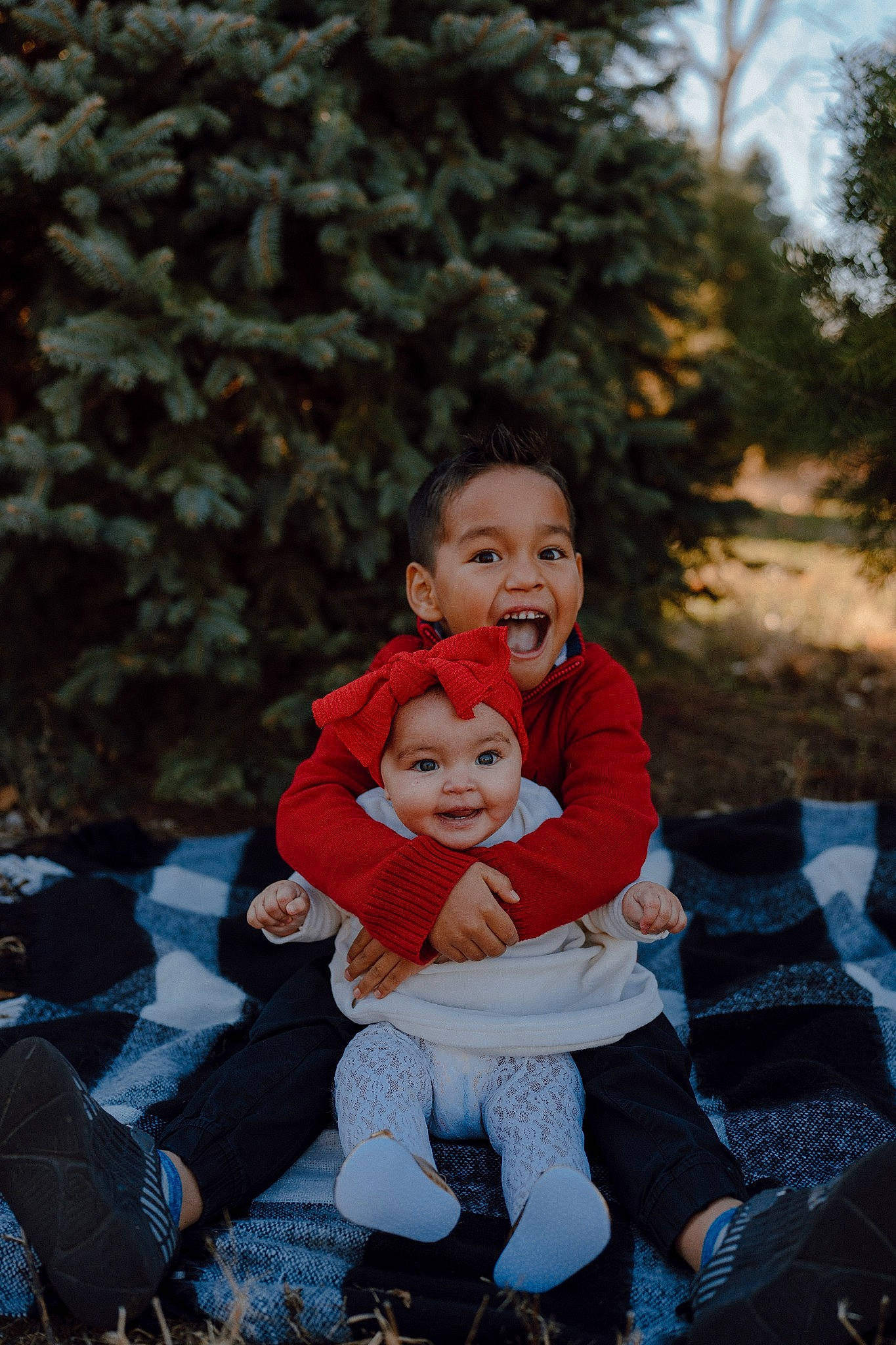 Eleni is registered to the contest to win money with this photo: baby, botany, child, event, flash_photography, fun, grass, happy, headwear, jeans, leaf, leisure, people_in_nature, person, plant, sitting, sky, smile, sneakers, toddler