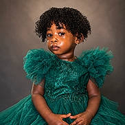 Jewel joined the competition — help win amazing prizes! background, child, curly_hair, cute, dress, earrings, expression, face, fashion, glitter, green, hands, innocence, portrait, puffy_sleeves, sitting, skin, studio, toddler, young
