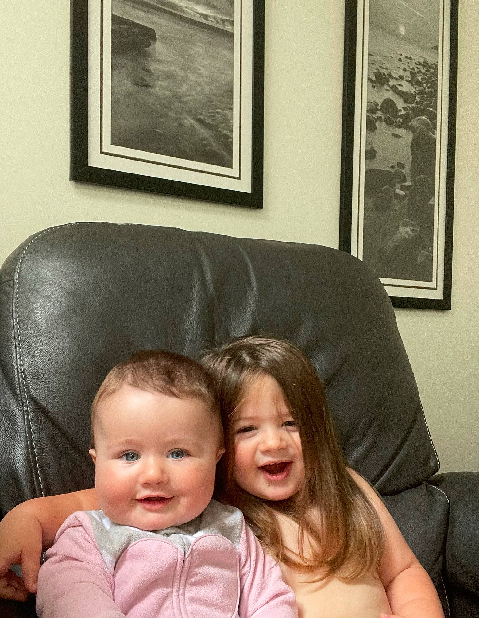 Phoenix is registered to the contest to win money with this photo: baby, beauty, black, child, comfort, couch, facial_expression, fun, furniture, happy, iris, living_room, person, photograph, picture_frame, room, skin, smile, studio_couch, toddler