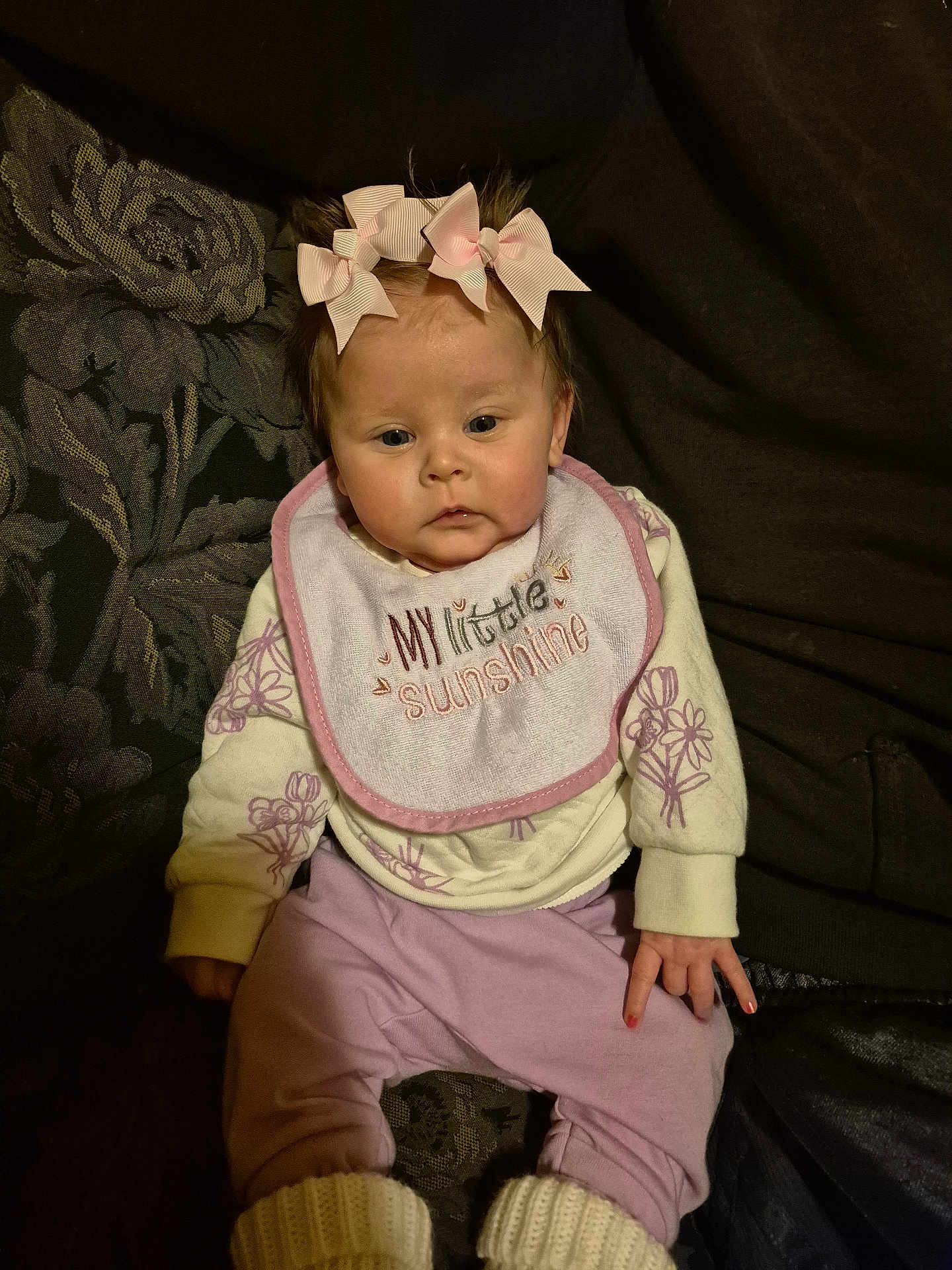 Lydia joined the competition — help win amazing prizes! baby, bib, bonnet, chair, clothing, couch, cushion, face, furniture, hat, head, homedecor, knitwear, newborn, pants, person, photography, portrait, sitting, sweater
