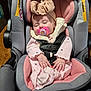 baby, bonnet, car, clothing, coat, crib, cushion, face, furniture, hat, head, homedecor, infantbed, jacket, person, photography, portrait, sleeping, transportation, vehicle