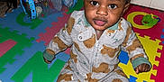 Jream joined the competition — help win amazing prizes! toddler, child, pajamas, bear_pattern, play_mat, toy, remote_control, colorful, indoor, floor, person, cute, curly_hair, sitting, baby, expression, plastic_toy, bag, home, playtime