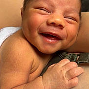 Waylon is registered to the contest to win money with this photo: baby, newborn, smile, hand, skin, infant, closeup, happy, child, human, cute, face, expression, portrait, holding, warmth, flesh, tiny, love, family