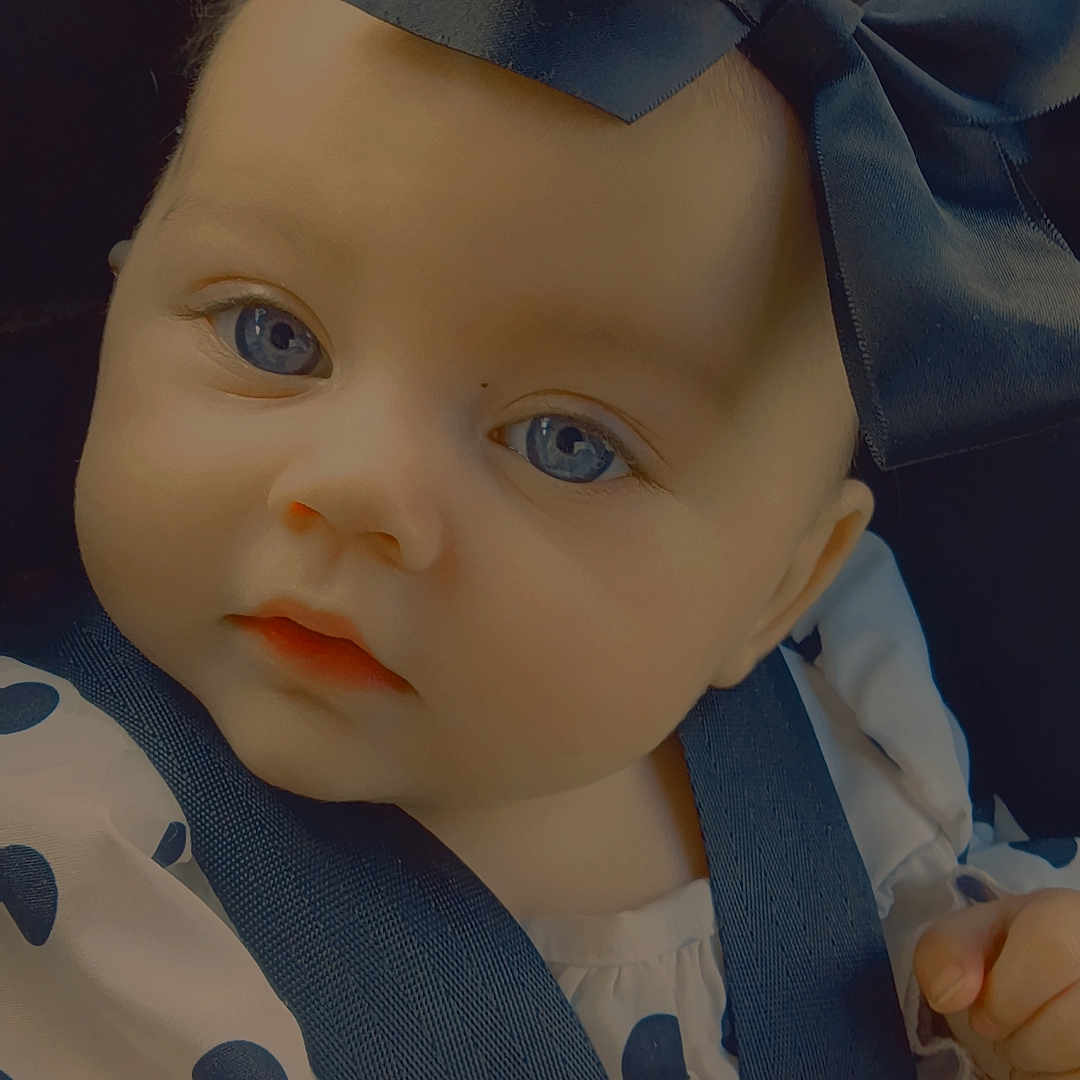 Fallon Elsa Grace is registered to the contest to win money with this photo: adorable, baby, blue_eyes, bow, car_seat, child, closeup, clothing, cute, face, headwear, indoor, infant, person, polka_dot, portrait, safety_harness, sitting, straps, young_child