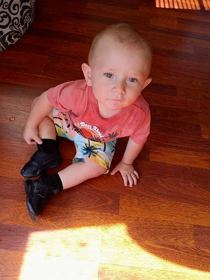 Huey joined the competition — help win amazing prizes! baby, baby_toddler_clothing, brown, cheek, child, finger, floor, flooring, hair, hardwood, head, laminate_flooring, leg, person, skin, sleeve, t_shirt, toddler, varnish, wood