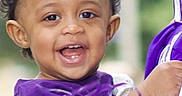 Espoir joined the competition — help win amazing prizes! toddler, child, smiling, cheerful, pom_poms, curly_hair, purple_clothing, close_up, face, happy, outdoor, person, young_child, joyful, portrait, candid, expression, excitement, celebration, fun