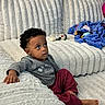 Espoir joined the competition — help win amazing prizes! toddler, child, indoor, couch, blanket, bottle, curly_hair, casual_clothing, barefoot, window_blinds, plush_furniture, relaxed, gazing_up, home, cozy, soft_texture, carpet, sitting, curious, comfortable