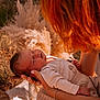 Sasha participe au concours pour gagner de l'argent avec cette photo : baby, sleeping, infant, red_hair, adult, outdoor, nature, pampas_grass, hands, peaceful, soft_light, portrait, close_up, skin, clothing, relaxation, mother, care, warm_colors, gentle