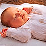 Sasha participe au concours pour gagner de l'argent avec cette photo : baby, sleeping, infant, blanket, pajamas, face, hands, peaceful, soft, cozy, cute, child, newborn, resting, warm_light, skin, portrait, closeup, relaxing, indoors