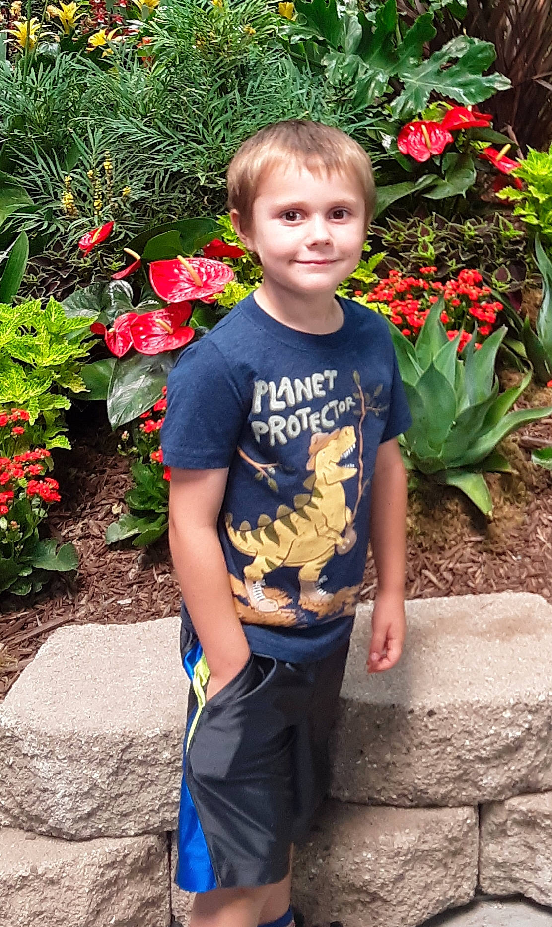 Gino joined the competition — help win amazing prizes! annual_plant, botany, electric_blue, face, flower, flowering_plant, grass, happy, joy, leaf, leisure, people_in_nature, person, petal, plant, red, rose, rose_family, smile, t_shirt