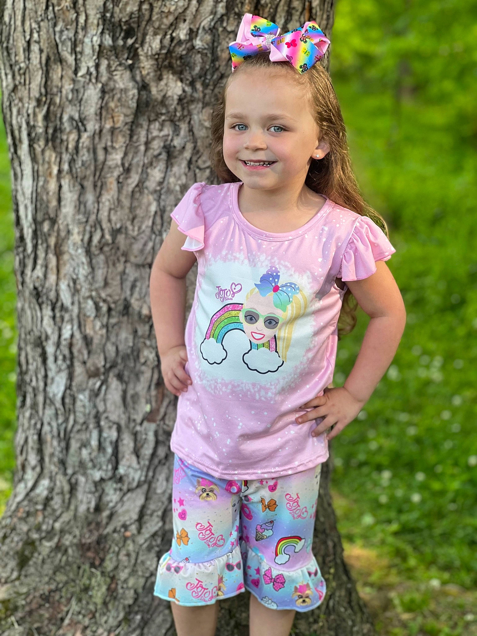 Louann is registered to the contest to win money with this photo: baby_toddler_clothing, clothing, cool, eye, face, fashion, grass, happy, head, joy, leaf, nature, people_in_nature, person, photograph, pink, shorts, sleeve, smile, standing