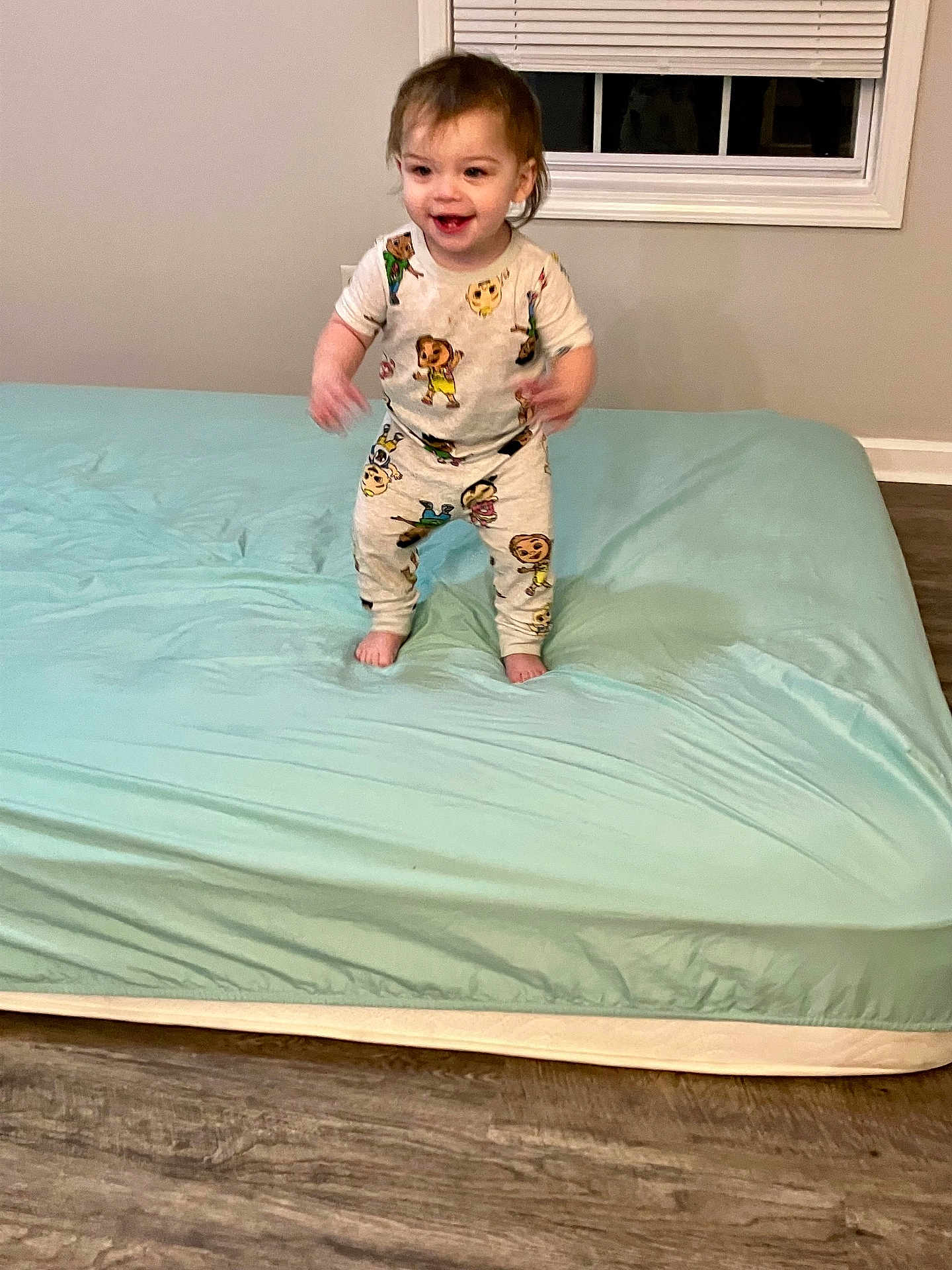 Creed joined the competition — help win amazing prizes! toddler, child, pajamas, bed, mattress, floor, window, blinds, smile, standing, indoors, happy, person, foot, hair, room, wood_floor, sleepwear, playful, young_child