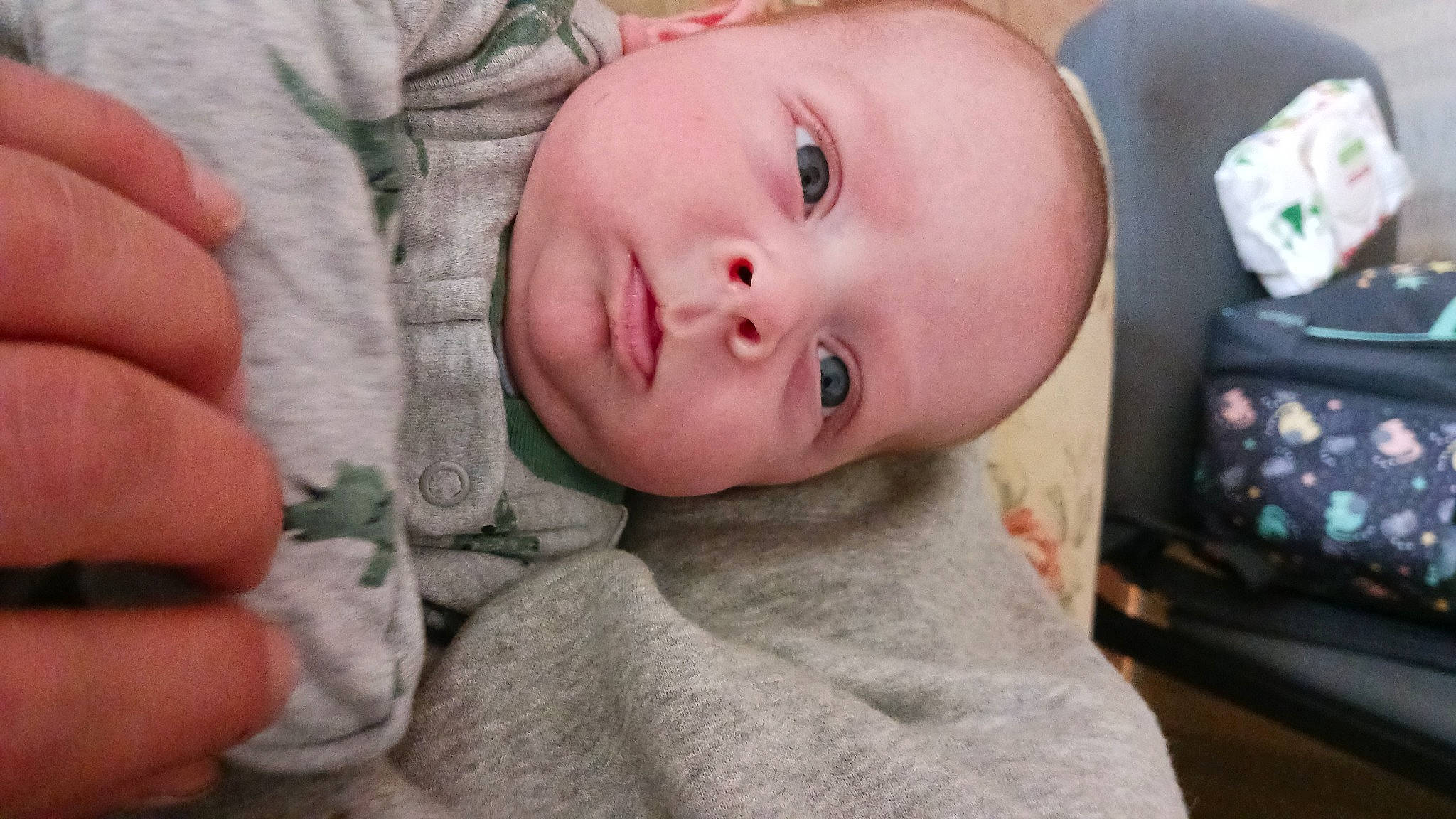 Tanner is registered to the contest to win money with this photo: baby, baby_toddler_clothing, cheek, child, comfort, eye, eyebrow, eyelash, finger, grass, iris, lip, mouth, nail, nose, person, skin, sleeve, smile, thumb