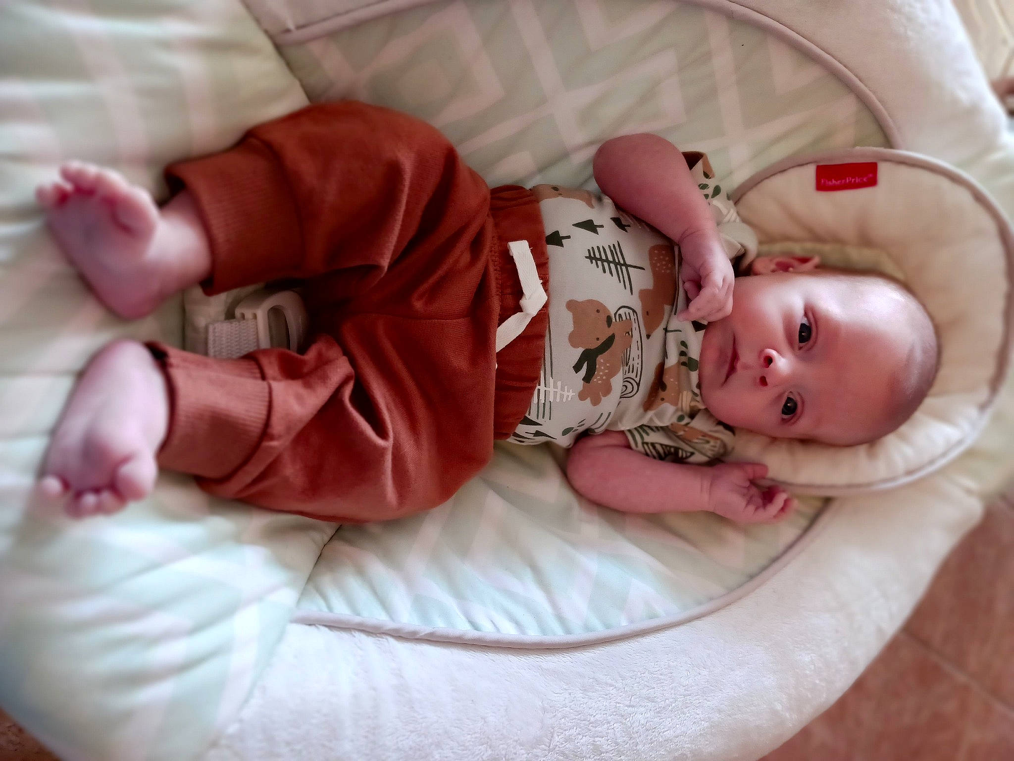 Tanner joined the competition — help win amazing prizes! baby, baby_products, baby_safety, baby_sleeping, baby_toddler_clothing, cheek, child, comfort, eye, finger, foot, hand, human_body, linens, person, pink, room, sitting, skin, sleeve