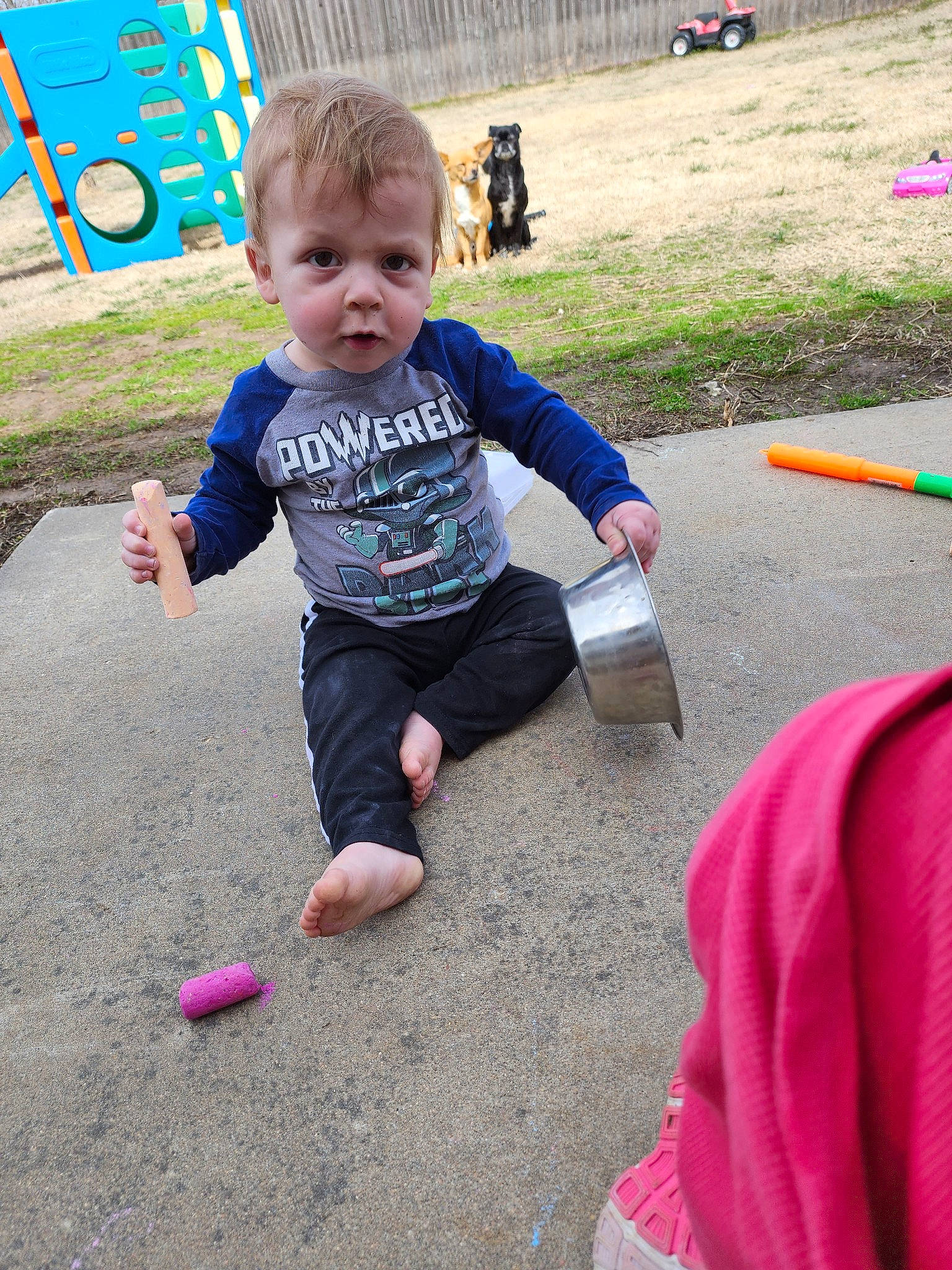 Tatum is registered to the contest to win money with this photo: asphalt, baby, child, event, fun, grass, happy, leisure, logo, person, pink, play, recreation, sand, shorts, sitting, soil, t_shirt, toddler, toy