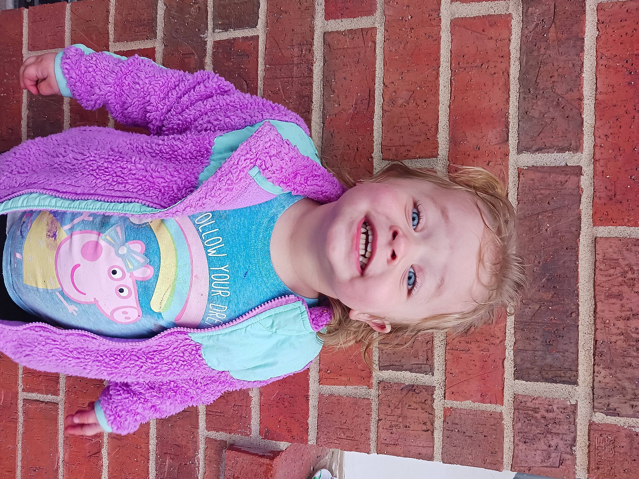 Tinsley joined the competition — help win amazing prizes! baby, baby_toddler_clothing, brick, brickwork, cheek, child, clothing, creative_arts, eye, face, happy, head, magenta, pattern, person, pink, purple, skin, sleeve, smile