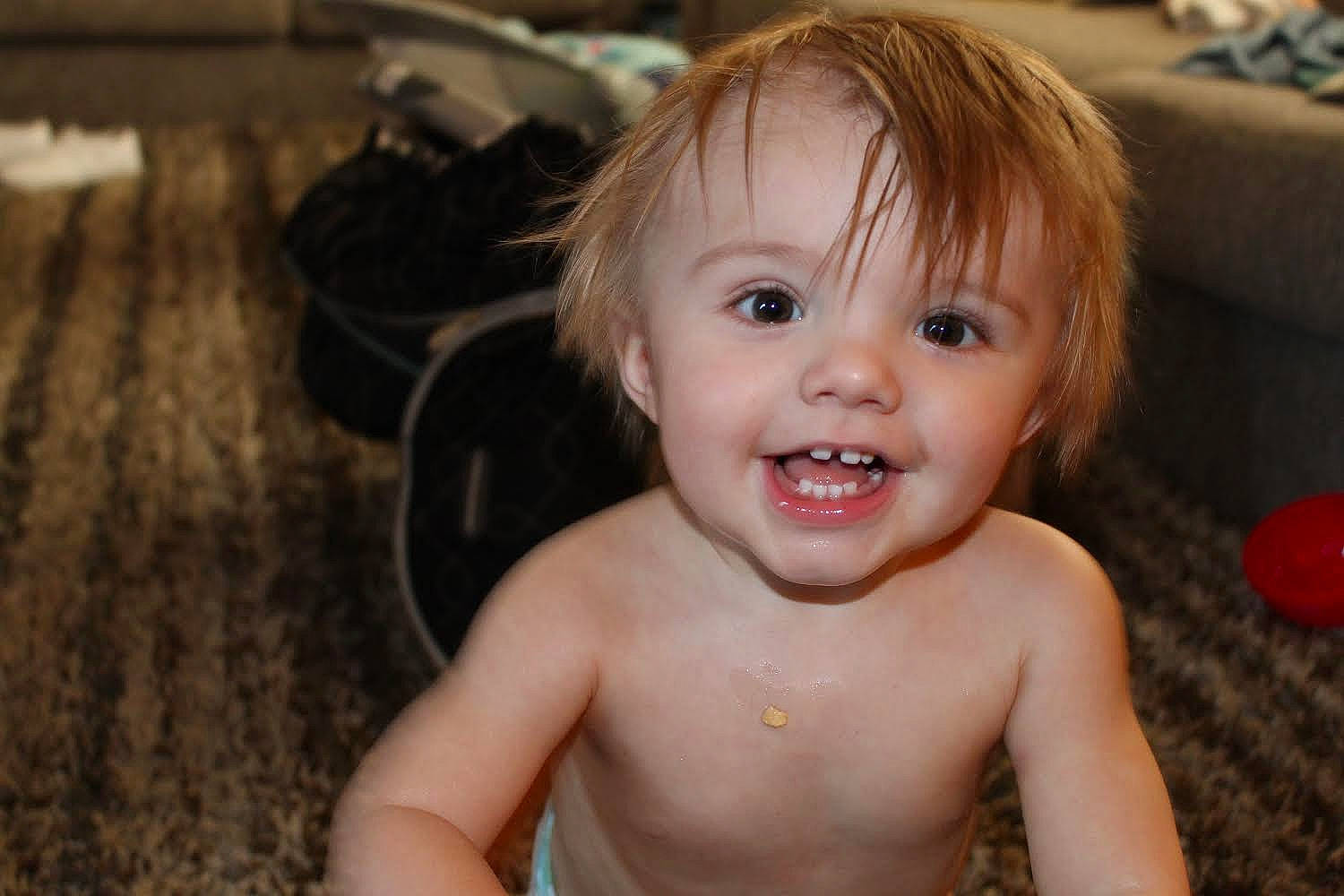 Huxley joined the competition — help win amazing prizes! baby, cheek, chest, child, couch, eye, eyebrow, eyelash, iris, laugh, lip, mouth, nose, organ, person, skin, throat, toddler, tongue, tooth