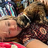 Monét is registered to the contest to win money with this photo: affection, bed, blanket, cat, clothes_rack, clothing, collar, cozy, cuddling, face, fur, human, indoors, person, pet, portrait, relaxed, sleepy, tortoiseshell_cat, whiskers