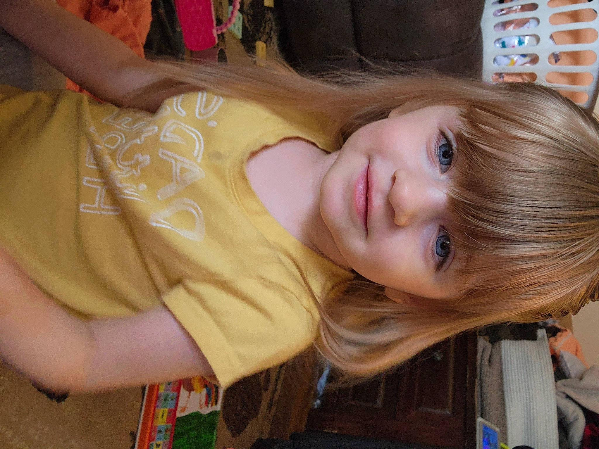 Emmalyn is registered to the contest to win money with this photo: blond, brown_hair, cheek, child, eyebrow, eyelash, fun, grass, happy, iris, joy, layered_hair, lip, long_hair, mouth, nose, person, skin, smile, t_shirt