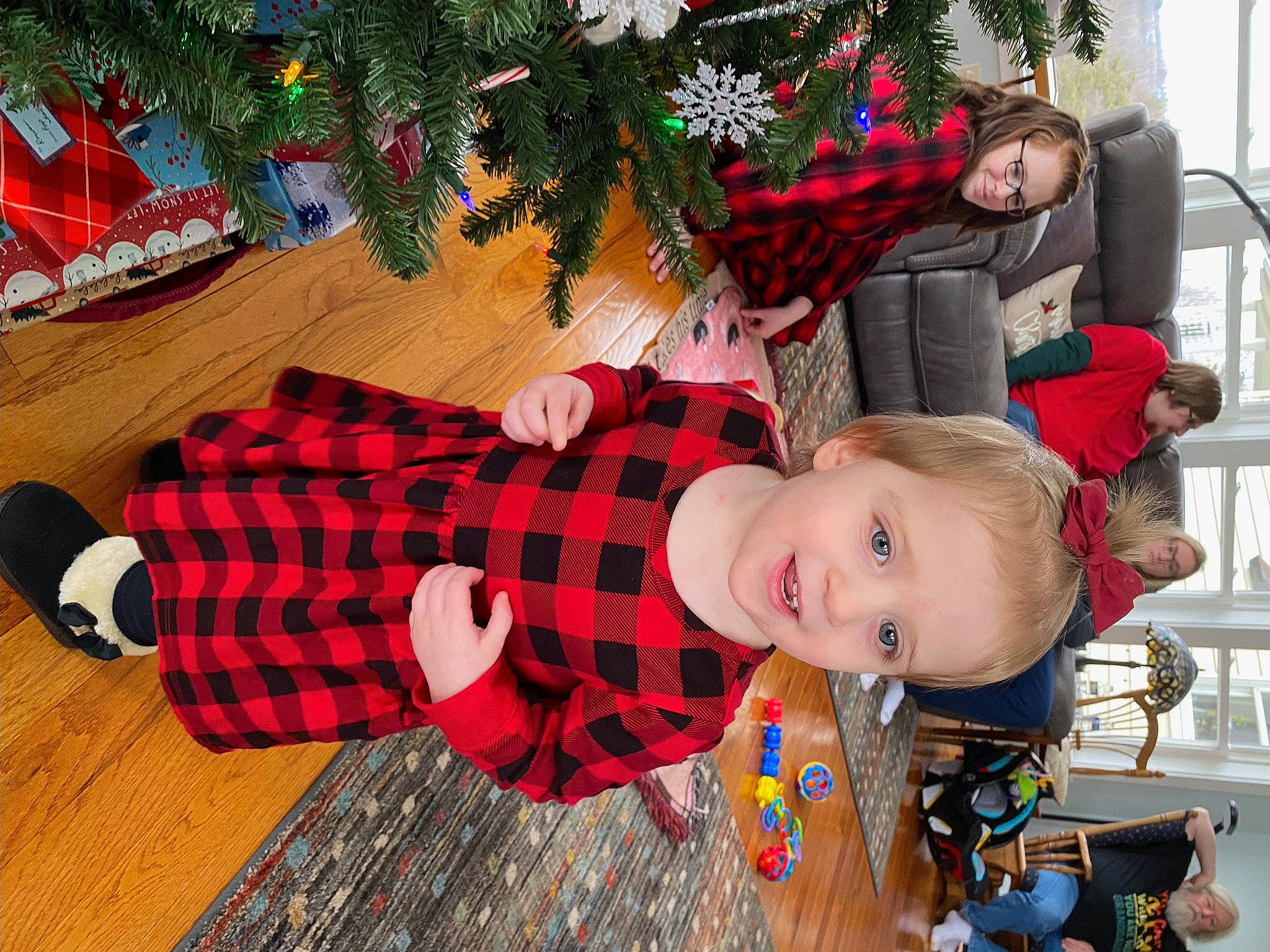 Clarissa is registered to the contest to win money with this photo: child, christmas, christmas_decoration, christmas_ornament, christmas_tree, event, green, happy, holiday, holiday_ornament, joy, pattern, person, plaid, plant, red, smile, tartan, toddler, tree