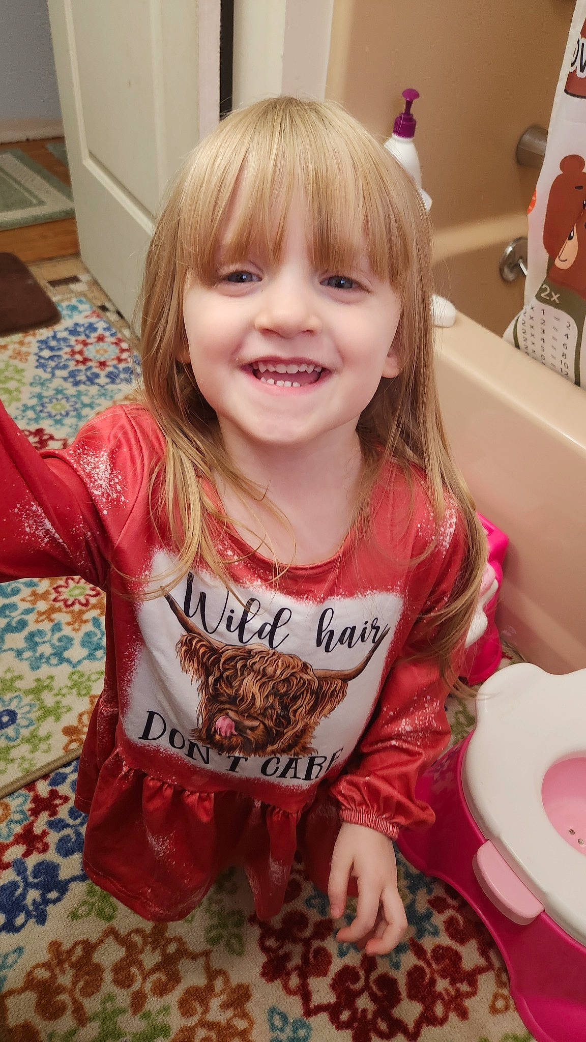 Evanna joined the competition — help win amazing prizes! baby_toddler_clothing, bangs, blond, cheek, child, face, fun, happy, joy, laugh, pattern, person, pink, play, room, sitting, sleeve, smile, t_shirt, toddler