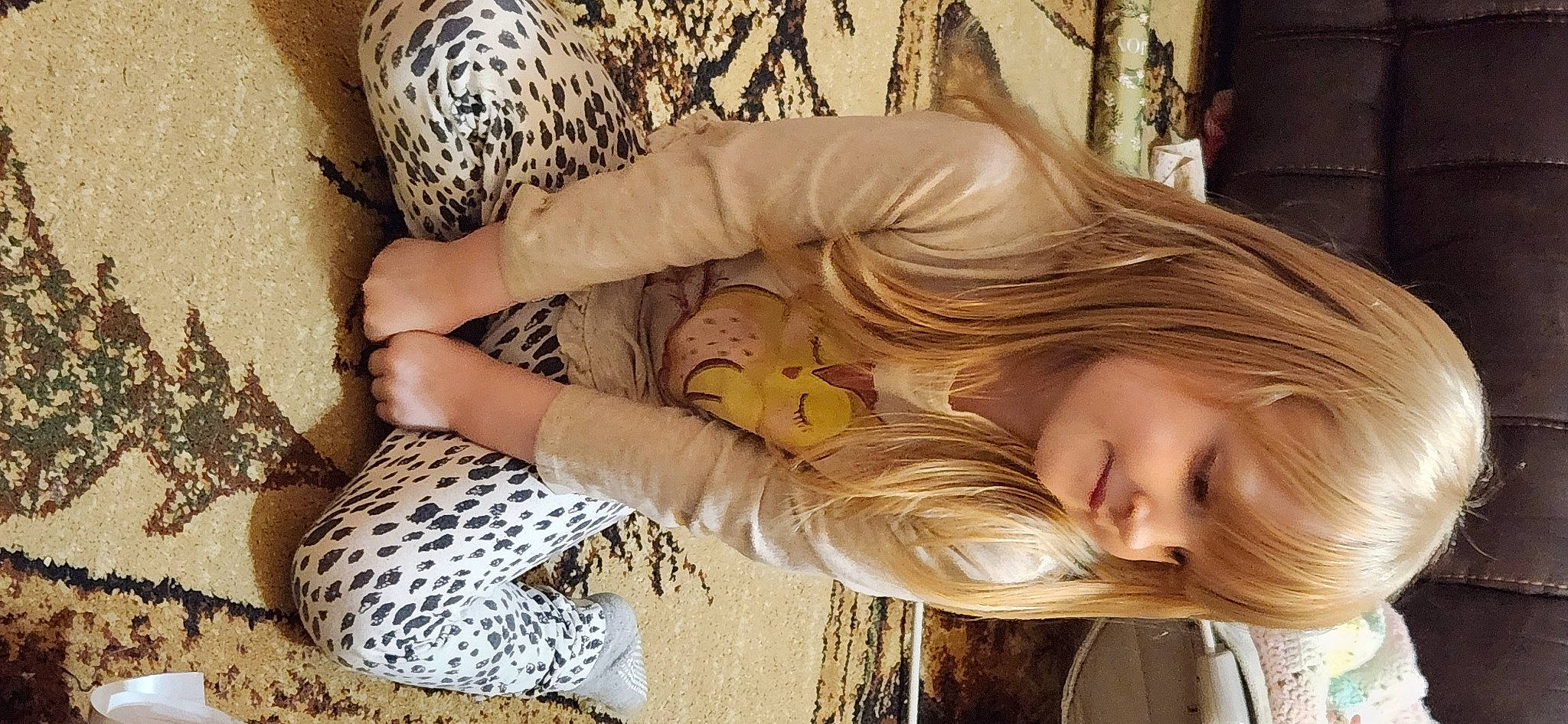 Evanna is registered to the contest to win money with this photo: blond, brown_hair, eye, eyelash, fawn, grass, hair, happy, head, human_leg, joy, long_hair, pattern, people_in_nature, person, sitting, skin, smile, surfer_hair, thigh