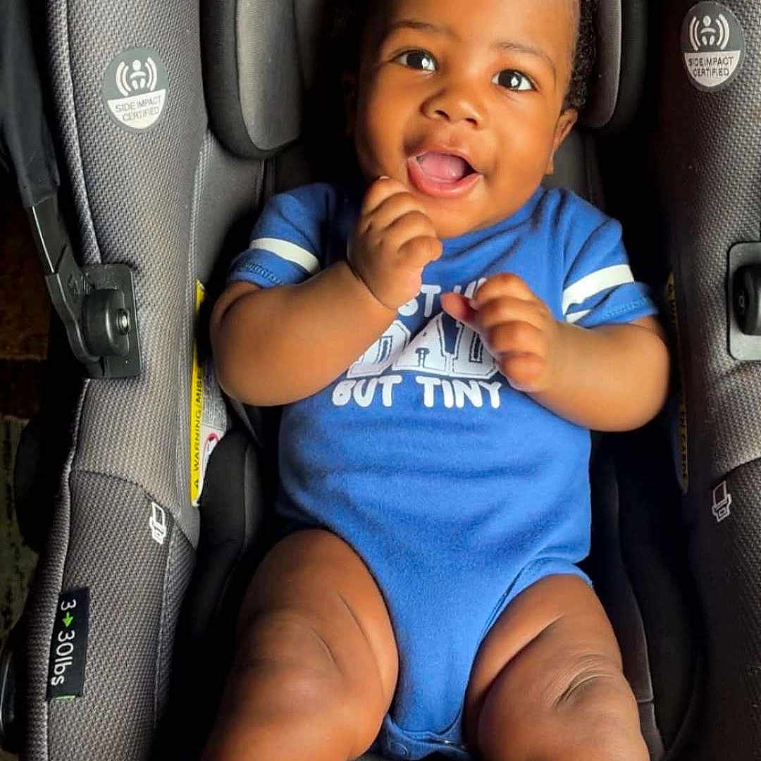 Dreycon joined the competition — help win amazing prizes! baby, black_hair, blue_outfit, car_seat, child, close_up, curly_hair, cute, happy, indoors, infant, photography, portrait, safety_harness, sitting, smiling, striped_socks, tongue_out, vehicle, white_socks
