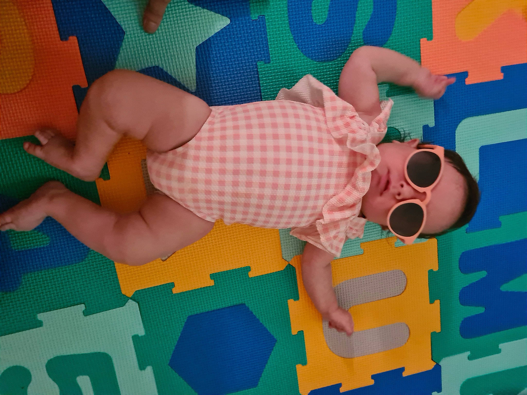 Ayla joined the competition — help win amazing prizes! art, azure, baby_toddler_clothing, child, finger, flooring, foot, fun, goggles, human_leg, knee, leisure, linens, orange, pattern, person, sunglasses, textile, thigh, toddler